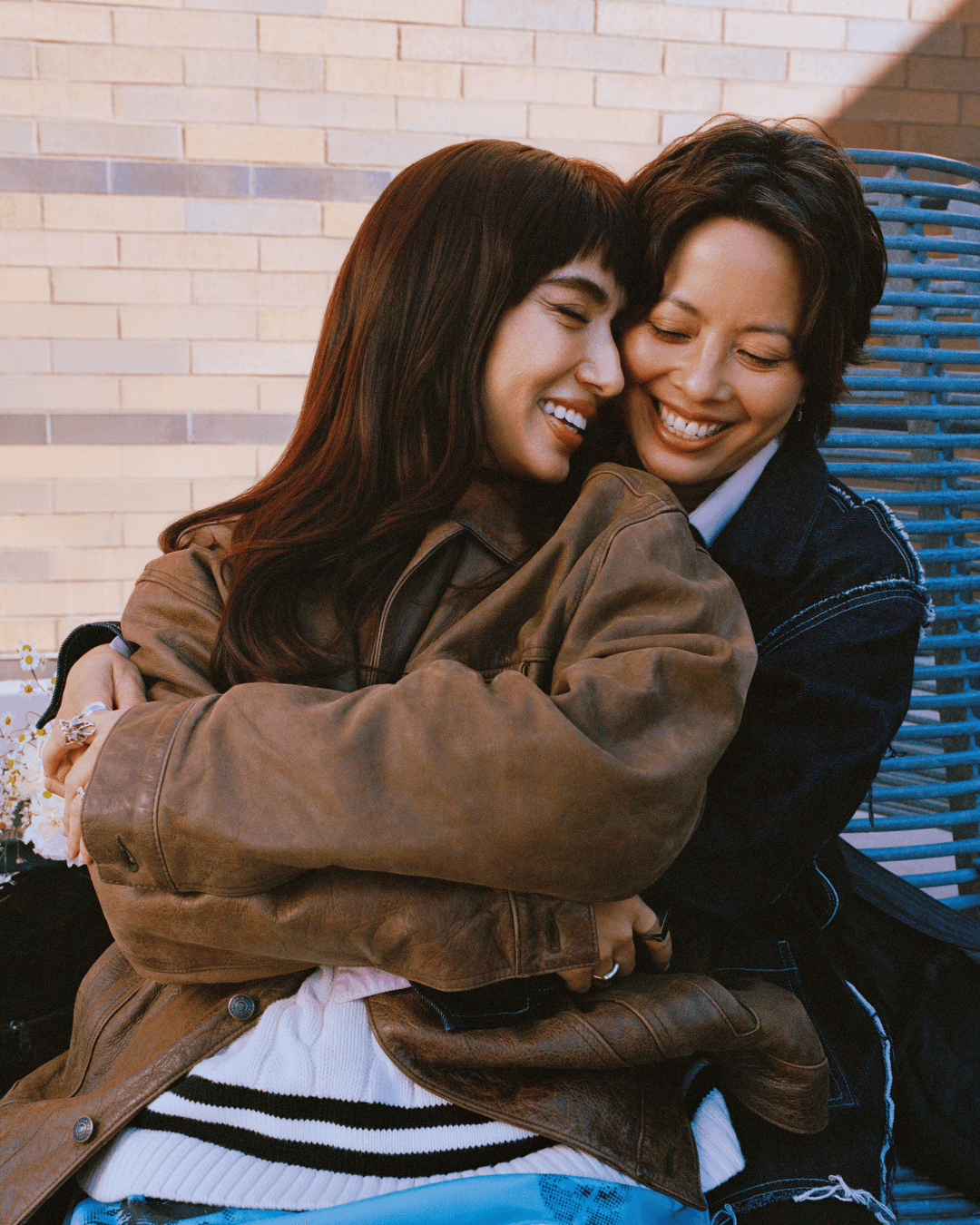 Ash and Angel are seated, in an embrace. They are laughing to eachother.