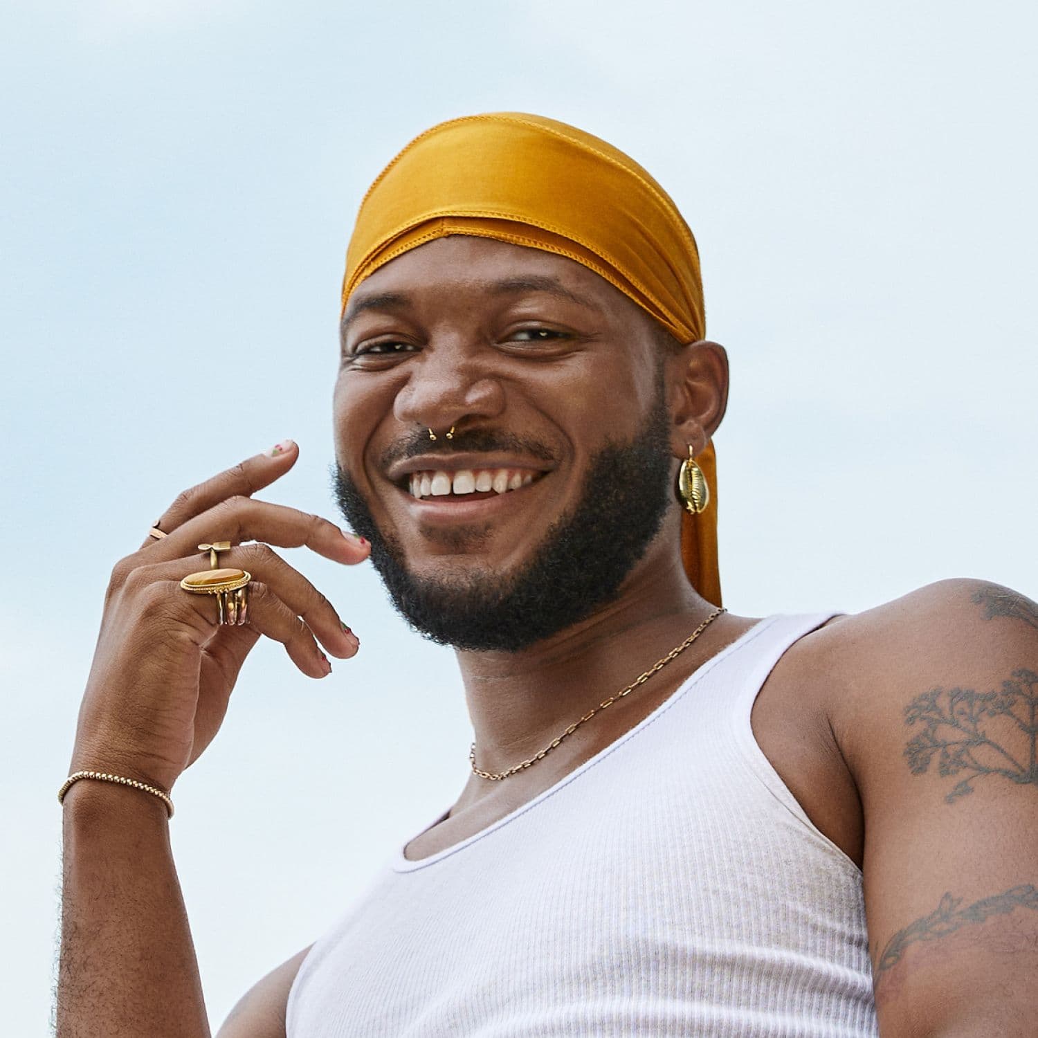 A portrait of Shahem leaning in and looking directly into camera. Their face feels serious but intentional.